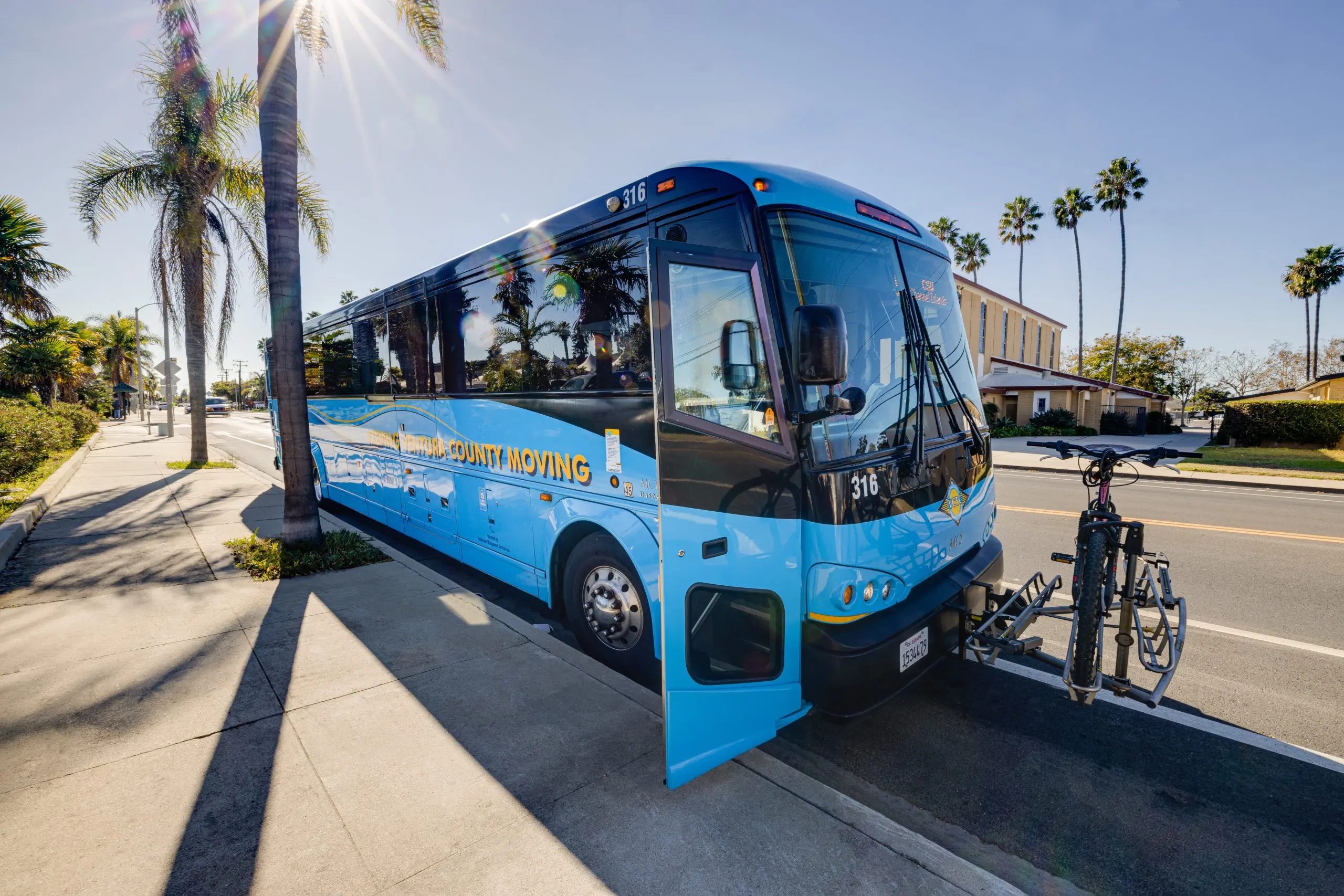 VCTC Express Bus parked on the side of the street with the door open