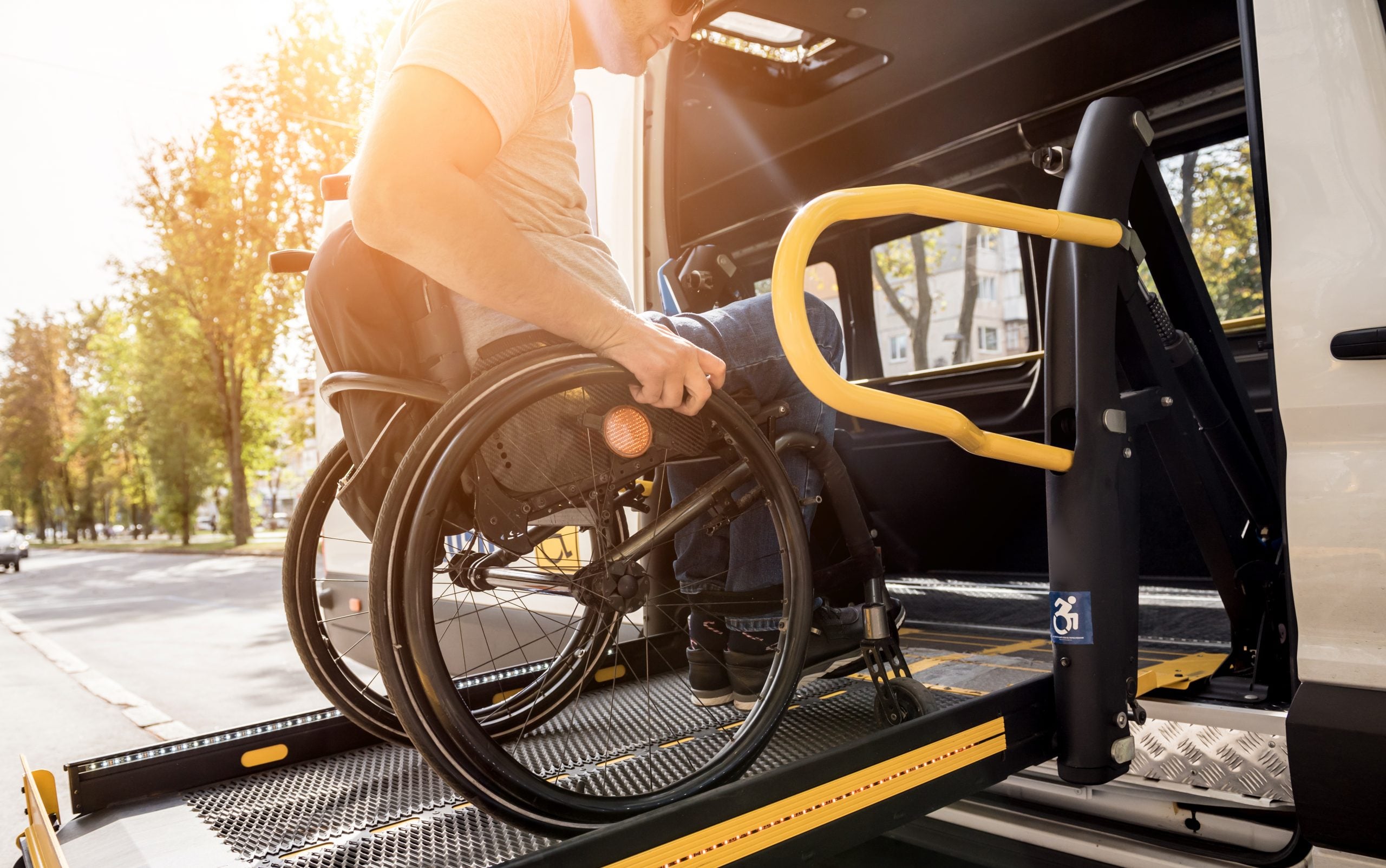 Person in wheelchair entering bus