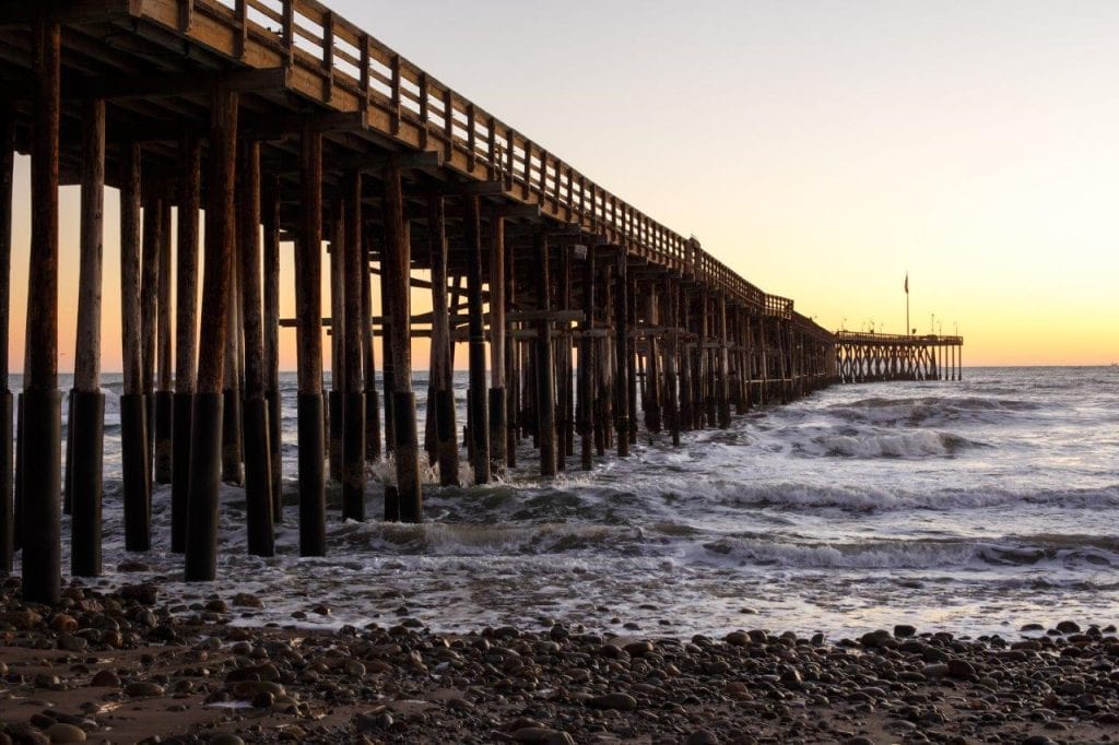 Ventura pier, pier going out into the oceans on rocky beach