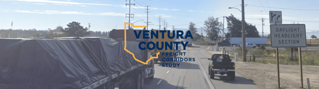Truck driving on a road with Freight Corridor logo over the image
